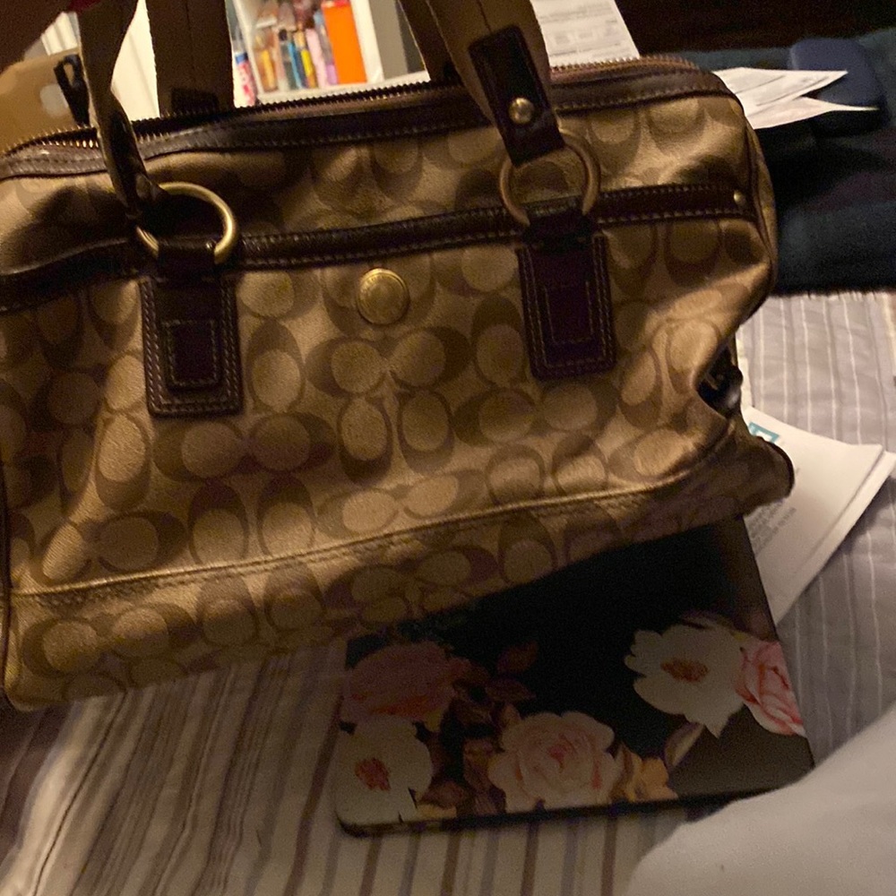 Vintage large spacious Coach handbag with studs and buckles. Good condition.